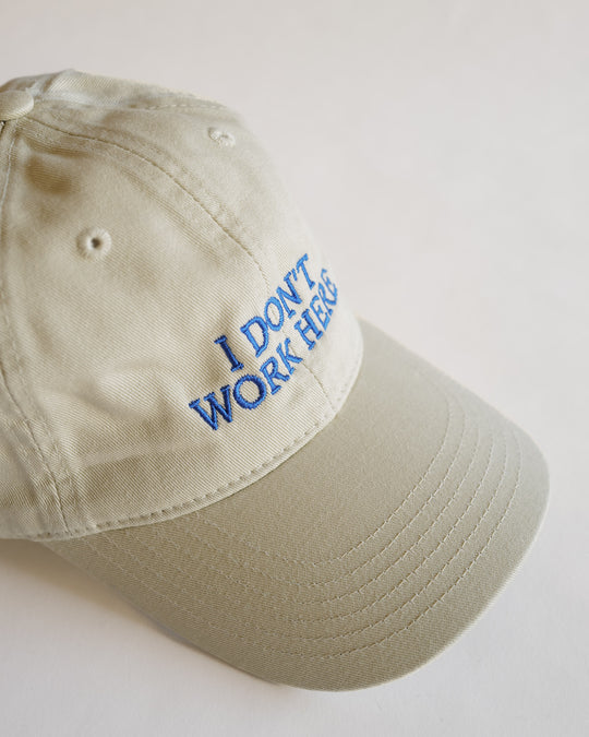 IDEA Books Sorry I Don't Work Here Hat (Cream) — IDEA Books, at SORT Vancouver