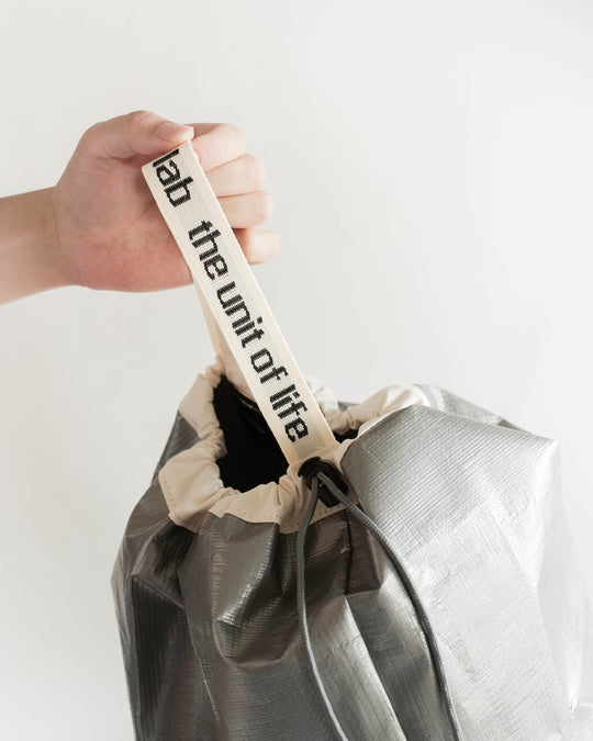 Rhombus Lab Bucket Tarp Bag - Silver — Rhombus Lab, South Korea, at SORT Vancouver