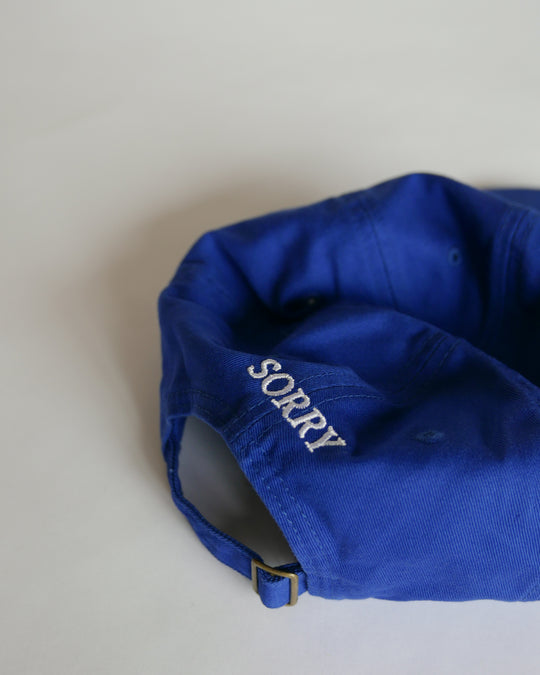 IDEA Books Sorry I Don't Work Here Hat (Royal Blue) — IDEA Books, at SORT Vancouver